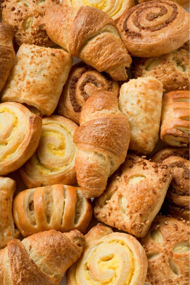 Assorted flaky pastries and croissants at Dragon Bay Bakery, a Chinese Bakery in Brooklyn