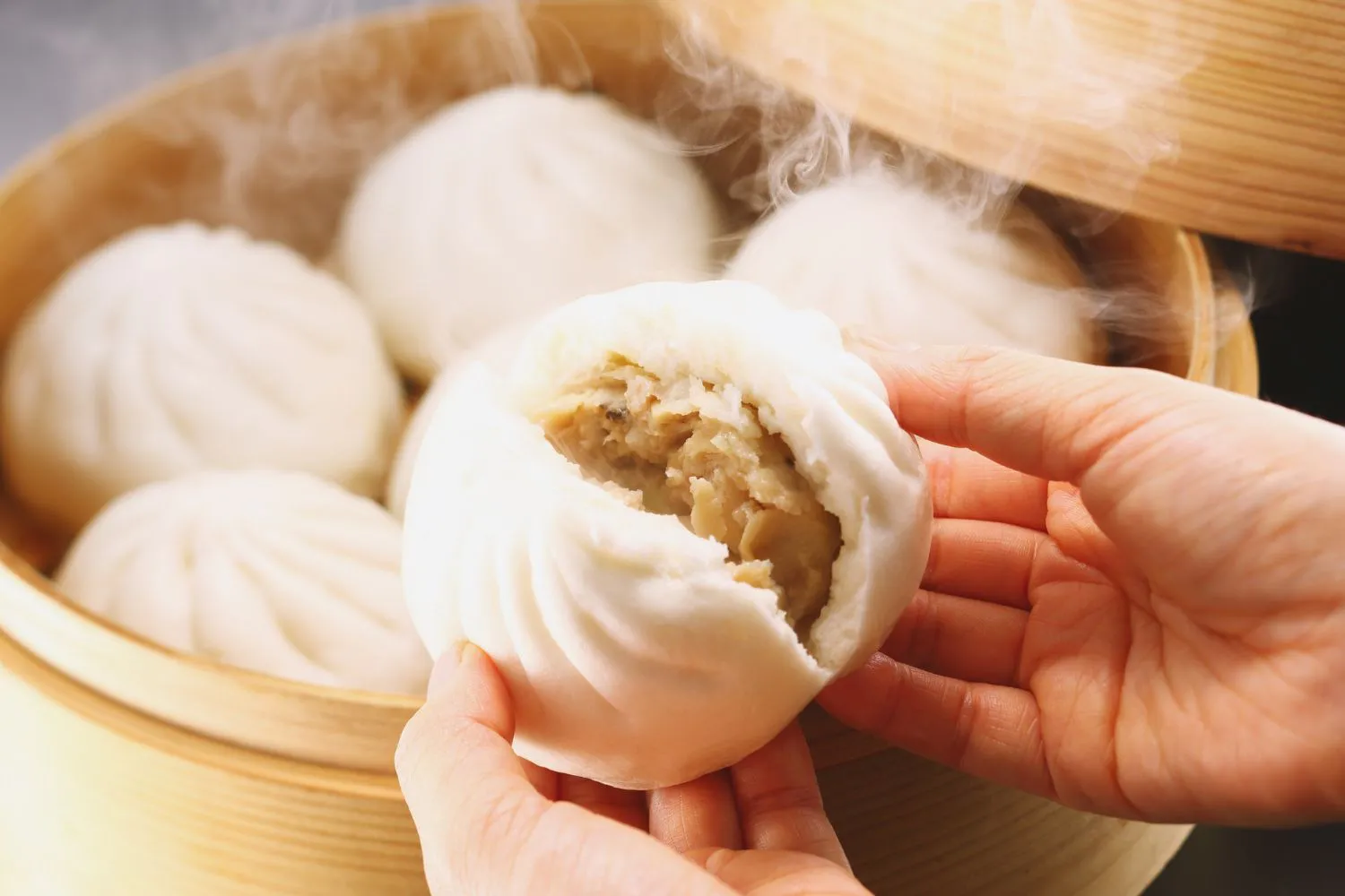 Steamed pork buns with juicy filling at Dragon Bay Bakery, a Chinese Bakery in Brooklyn