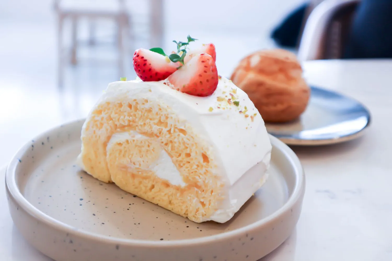 Strawberry roll cake with cream topping at Dragon Bay Bakery, a Chinese Bakery in Brooklyn
